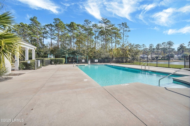 view of swimming pool with a patio