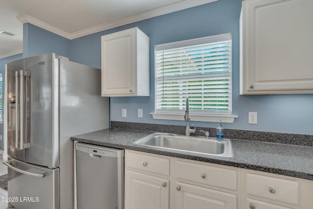 kitchen featuring white cabinetry, ornamental molding, stainless steel appliances, and sink