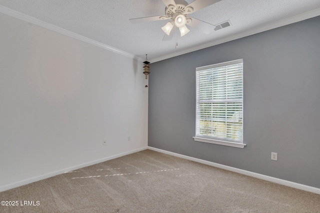 unfurnished room featuring ceiling fan, ornamental molding, carpet floors, and a textured ceiling