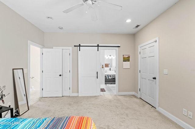 2654 Broad St, Beaufort, SC 29902 - unfurnished bedroom featuring carpet floors, a barn door, recessed lighting, baseboards, and connected bathroom