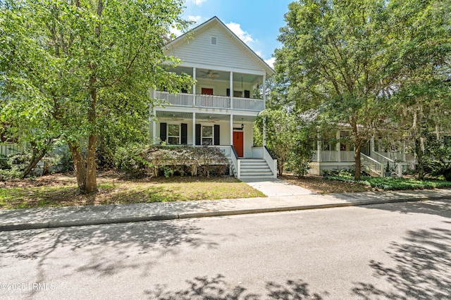 2654 Broad St, Beaufort, SC 29902 - view of front of house featuring ceiling fan, covered porch, and a balcony