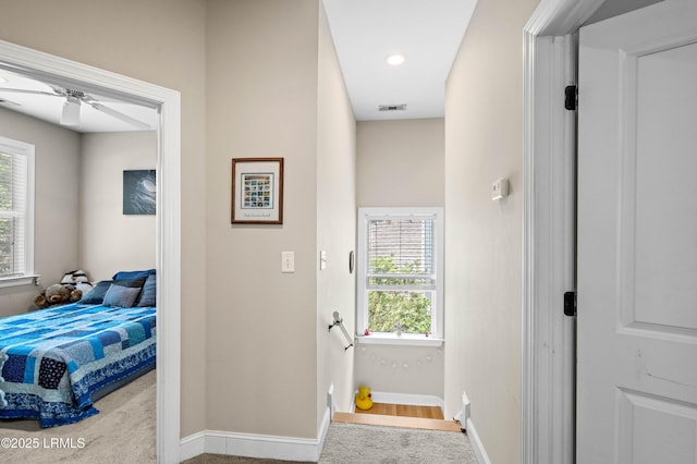 2654 Broad St, Beaufort, SC 29902 - corridor with healthy amount of natural light, baseboards, carpet floors, and an upstairs landing
