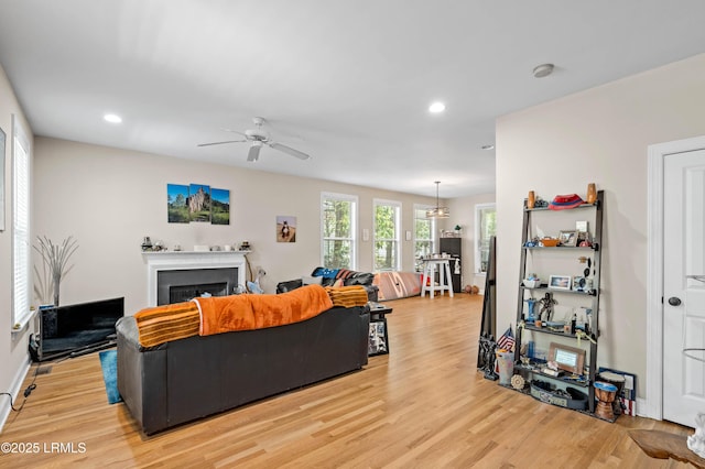 2654 Broad St, Beaufort, SC 29902 - living room with light wood finished floors, a ceiling fan, recessed lighting, a fireplace, and baseboards