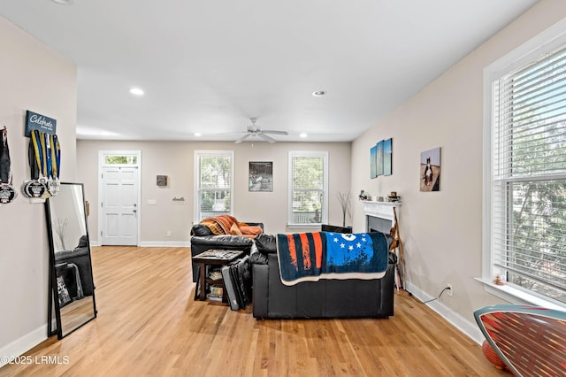 2654 Broad St, Beaufort, SC 29902 - living area with light wood-type flooring, baseboards, ceiling fan, recessed lighting, and a fireplace