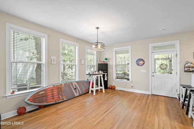 2654 Broad St, Beaufort, SC 29902 - recreation room with light wood-style floors, baseboards, and a chandelier
