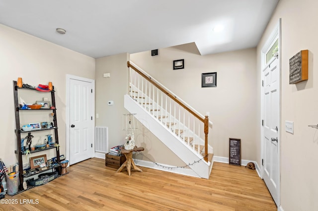 2654 Broad St, Beaufort, SC 29902 - foyer featuring stairs, light wood-style floors, and baseboards