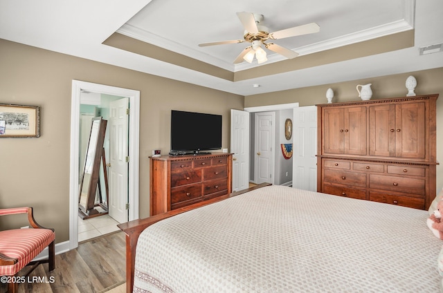 49 National Blvd, Beaufort, SC 29907 - bedroom with a raised ceiling, ornamental molding, light wood-type flooring, a ceiling fan, and ensuite bathroom