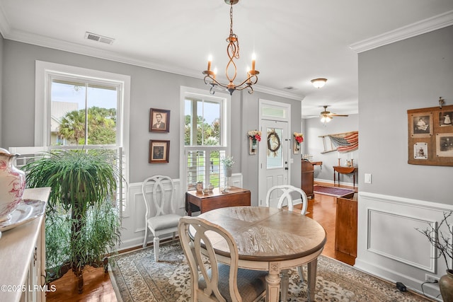 49 National Blvd, Beaufort, SC 29907 - dining space with wood finished floors, crown molding, a chandelier, wainscoting, and ceiling fan