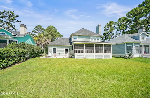49 National Blvd, Beaufort, SC 29907 - rear view of property with a sunroom, a lawn, and a shingled roof