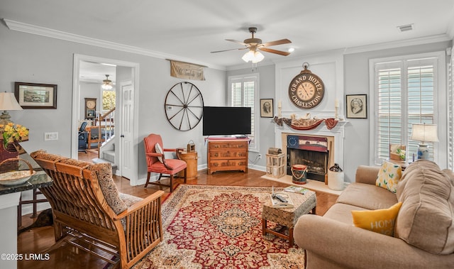 49 National Blvd, Beaufort, SC 29907 - living area with a ceiling fan, wood finished floors, ornamental molding, and a fireplace with flush hearth