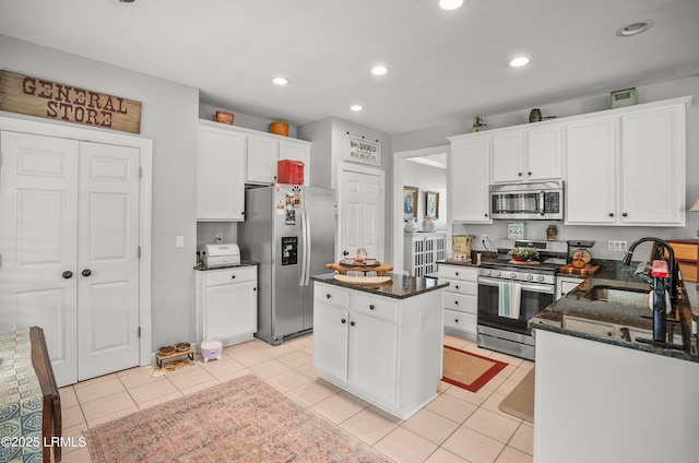 49 National Blvd, Beaufort, SC 29907 - kitchen featuring stainless steel appliances, a center island, white cabinets, recessed lighting, and dark stone countertops