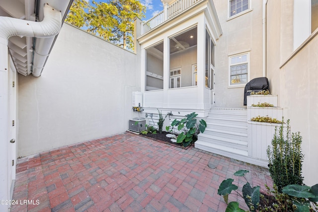 exterior space featuring a patio and a balcony