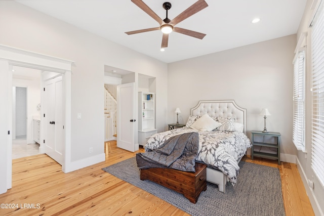 bedroom featuring hardwood / wood-style flooring and ceiling fan