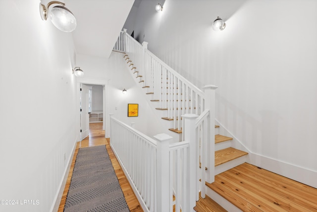 staircase featuring hardwood / wood-style floors