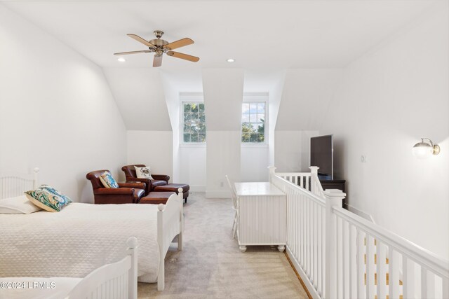 carpeted bedroom featuring ceiling fan and lofted ceiling