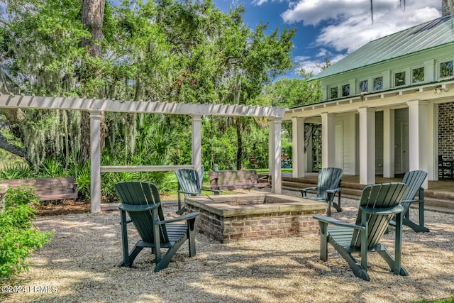 view of patio / terrace featuring an outdoor fire pit