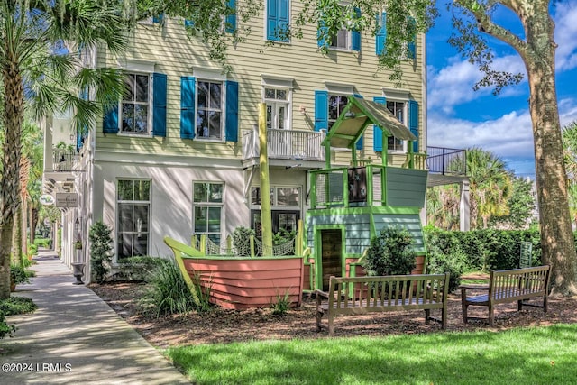 back of property featuring a balcony