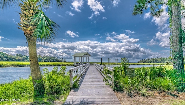 view of dock with a gazebo and a water view