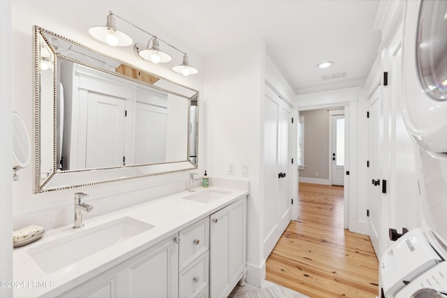 bathroom with wood-type flooring and vanity