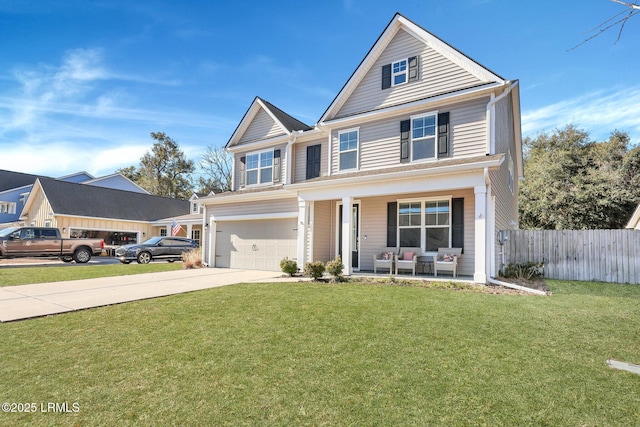 view of front of house with a porch, a garage, and a front yard