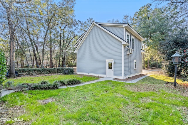 view of side of property featuring a yard