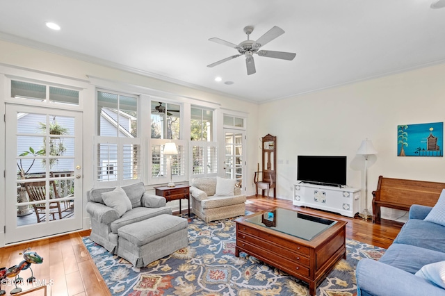 living area featuring ceiling fan, recessed lighting, crown molding, and wood finished floors