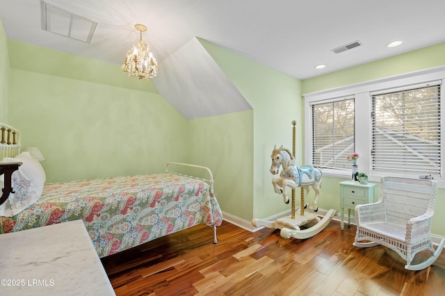 bedroom with recessed lighting, wood finished floors, visible vents, baseboards, and an inviting chandelier