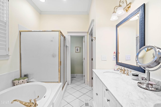 bathroom with crown molding, a stall shower, vanity, a jetted tub, and tile patterned floors