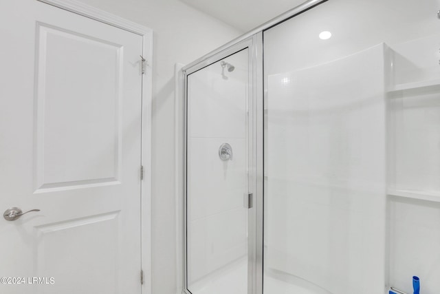 bathroom featuring an enclosed shower