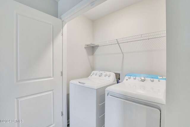 laundry room with independent washer and dryer