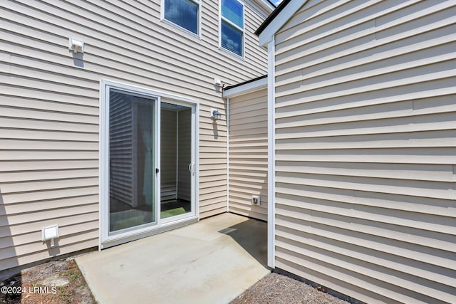 entrance to property featuring a patio area