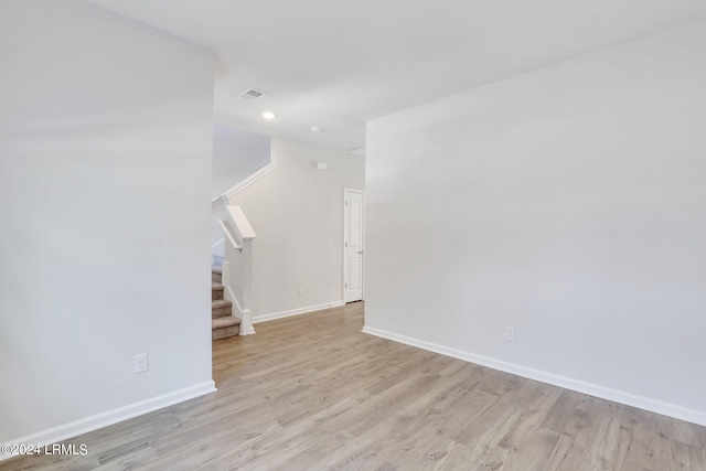 unfurnished living room with light wood-type flooring