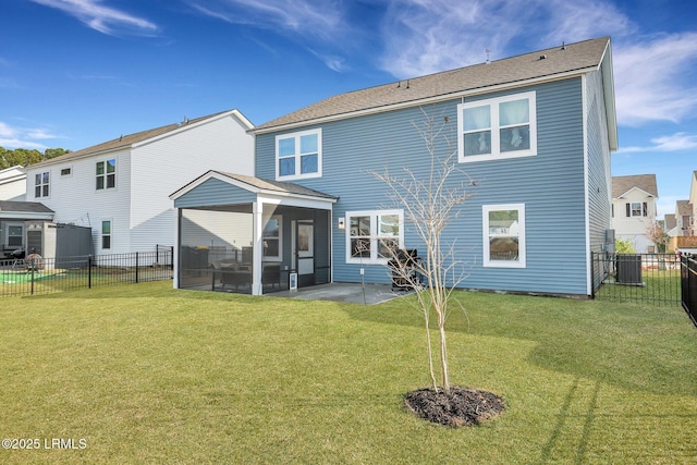 back of house with a patio, a sunroom, a yard, and central AC