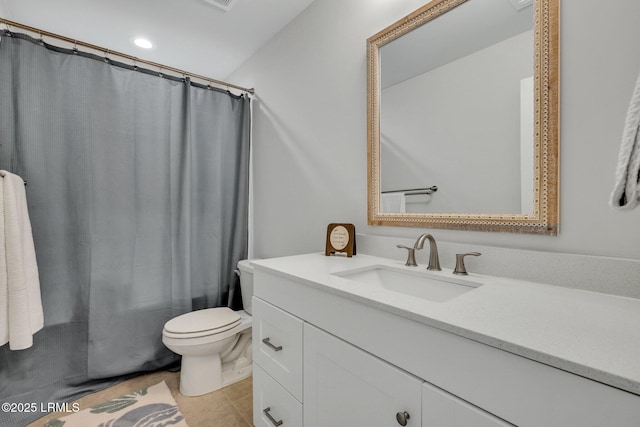 full bathroom featuring shower / bath combo with shower curtain, tile patterned floors, toilet, and vanity