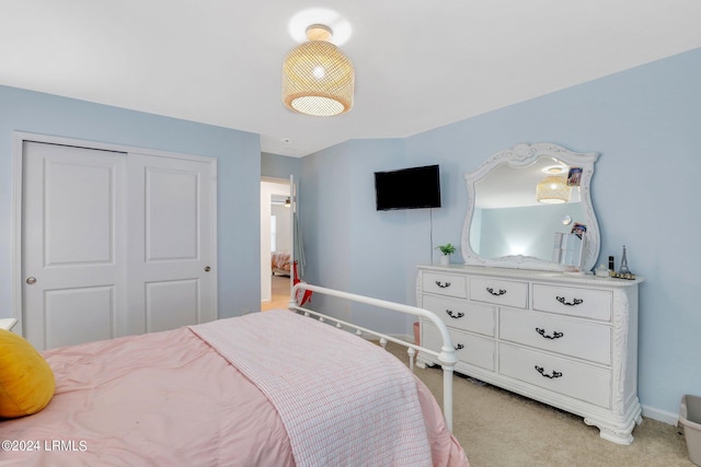 carpeted bedroom with a closet