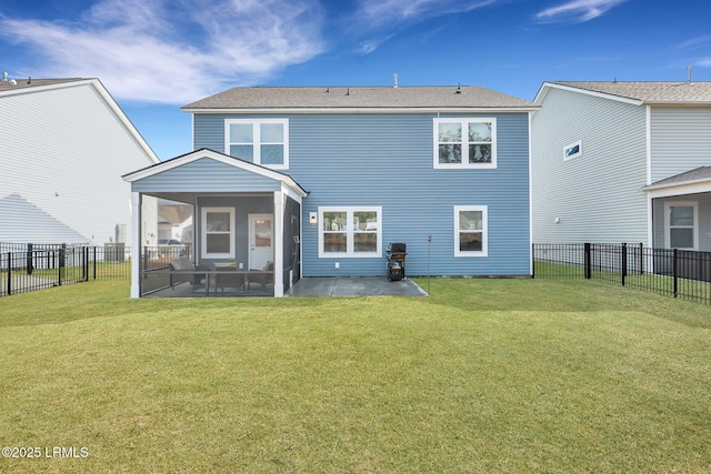 back of property with a yard and a sunroom