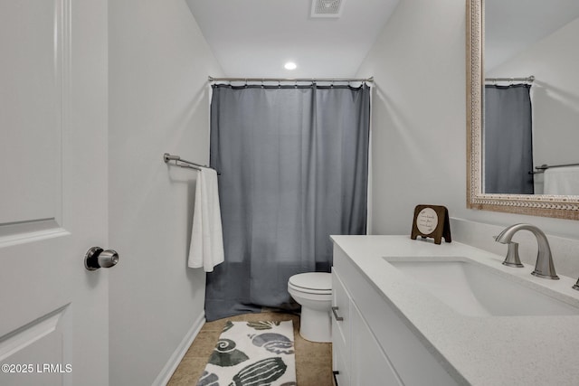 bathroom with vanity, tile patterned floors, and toilet