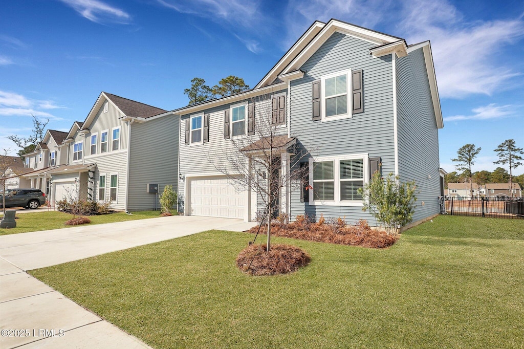 view of front of home featuring a garage and a front yard