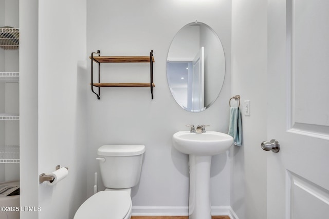 bathroom featuring sink and toilet