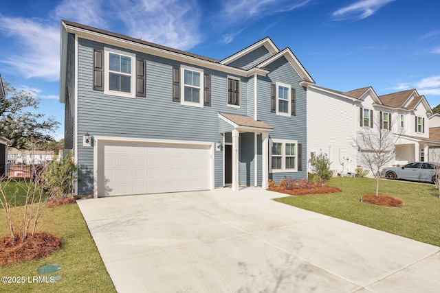 view of front facade with a garage and a front yard