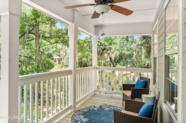 sunroom / solarium with ceiling fan