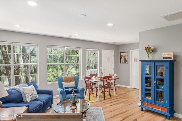 interior space with recessed lighting, baseboards, light wood finished floors, and visible vents