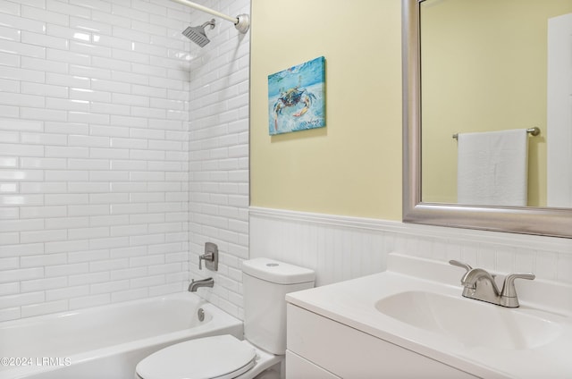 full bathroom featuring vanity, shower / bathing tub combination, wainscoting, and toilet