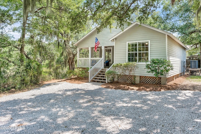 view of front facade featuring covered porch and crawl space