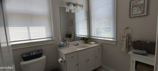 bathroom with vanity and toilet