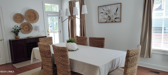 dining room featuring hardwood / wood-style floors and a healthy amount of sunlight