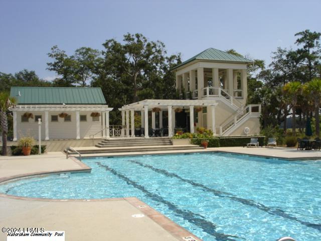 view of swimming pool featuring a pergola and a patio area