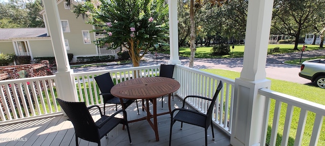 wooden terrace with a porch