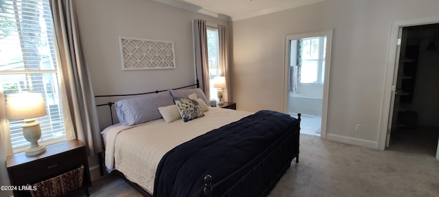 carpeted bedroom with ornamental molding