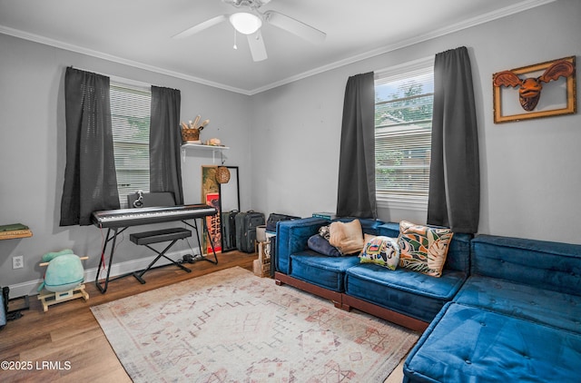 1508 London Ave, Port Royal, SC 29935 - sitting room with wood finished floors, a ceiling fan, and crown molding